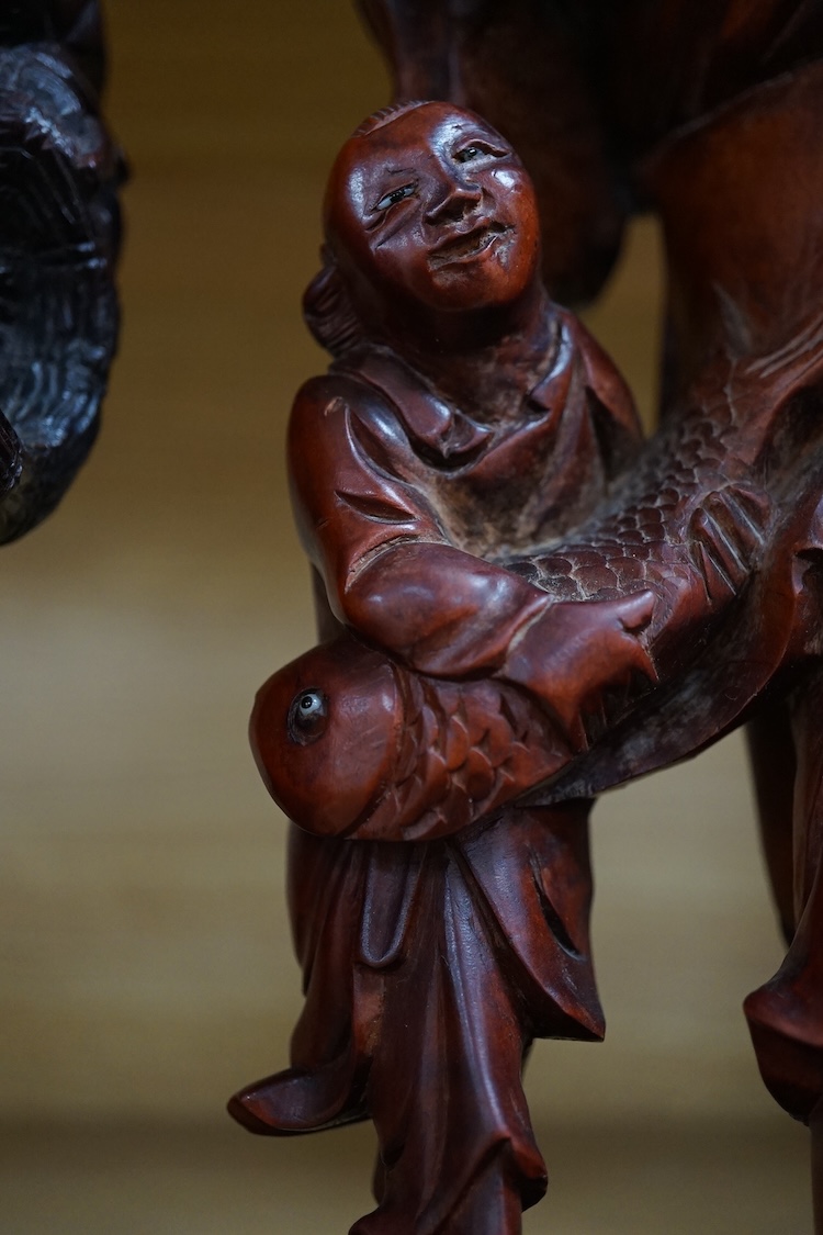 Three Chinese carved wood figures of elders, largest 37cm high